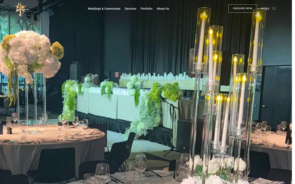 The LC Events homepage on desktop: a candlelit reception with tall floral centrepieces